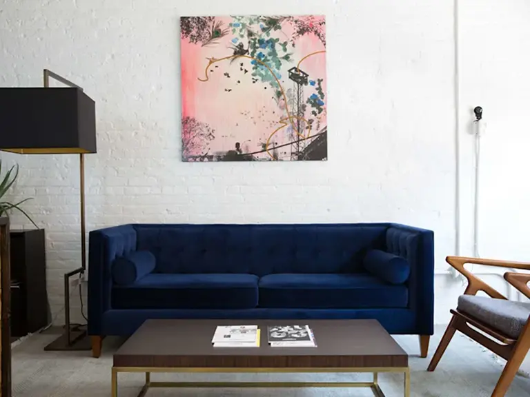 Kip and Tam Barnard Group, San Jose real estate Indigo sofa and pink painting on the wall 1.