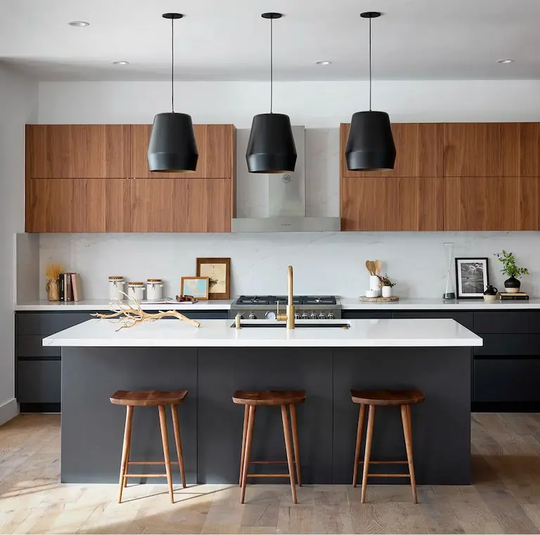 Silicon Valley property real estate agents Kitchen black units with white marble worktops.